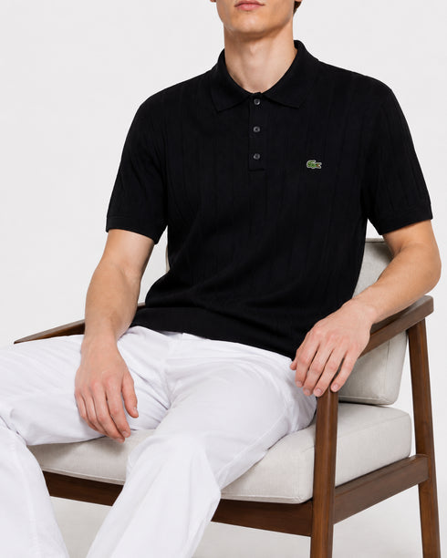 LACOSTE LOGO-APPLIQUÉ RIBBED KNIT POLO SHIRT – BLACK